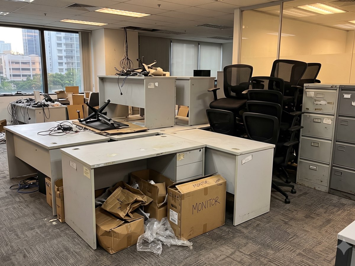 Office manager's photo of desks, chairs and filing cabinets sent on WhatsApp for a clearance quote in Singapore