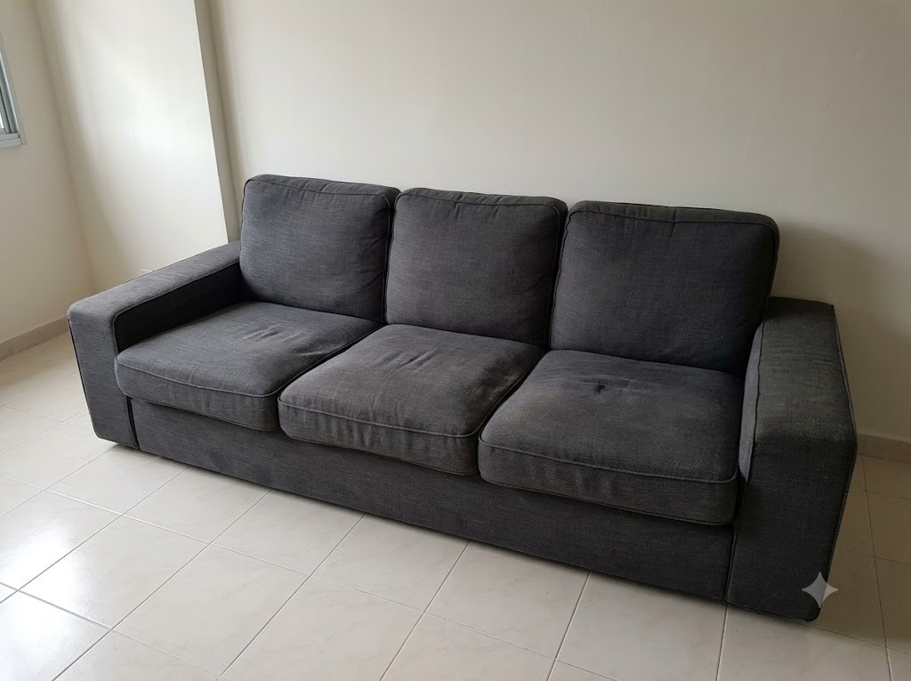 Customer photo of an old 3-seater sofa sent on WhatsApp for a disposal quote in Singapore